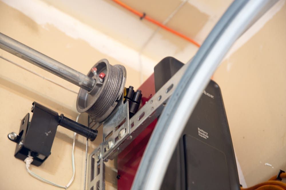 A close up of a garage door opener in a garage.